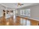 Bright living area with hardwood floors, fireplace, and open to kitchen at 1426 Phelps Ridge Dr, Fuquay Varina, NC 27526
