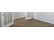 Close up of wood-look flooring with white trim and a white door with glass panels at 144 Paper Birch Way, Fuquay Varina, NC 27526