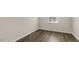 Bedroom featuring stylish wood flooring and lots of natural light at 151 Paper Birch Way, Fuquay Varina, NC 27526