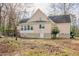 Rear exterior of home with deck and sunroom, showing fenced area under deck at 1514 Wiljohn Rd, Garner, NC 27529