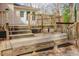 Multi-level wooden deck offers a spacious outdoor living area for enjoyment at 1514 Wiljohn Rd, Garner, NC 27529