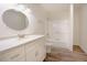 Bright bathroom with shower and double sink vanity at 1514 Wiljohn Rd, Garner, NC 27529