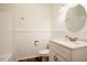 Bright bathroom with white vanity, granite countertop, and neutral walls at 1514 Wiljohn Rd, Garner, NC 27529