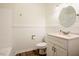 Bright bathroom with white vanity, granite countertop, and neutral walls at 1514 Wiljohn Rd, Garner, NC 27529