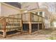 Close up view of deck with screened enclosure underneath at 1514 Wiljohn Rd, Garner, NC 27529