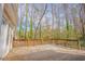 Large wooden deck with railings, surrounded by trees, perfect for outdoor relaxation at 1514 Wiljohn Rd, Garner, NC 27529