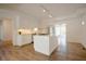 Bright kitchen with stainless appliances, white cabinets, and a center island at 1514 Wiljohn Rd, Garner, NC 27529