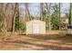 Backyard storage shed on wooded lot at 1514 Wiljohn Rd, Garner, NC 27529