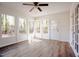 Inviting sunroom with lots of natural light and wood floors at 1514 Wiljohn Rd, Garner, NC 27529