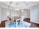 Open dining room with hardwood floors and modern lighting, adjacent to the kitchen and living areas at 197 Royal Oak Ln, Garner, NC 27529