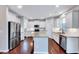 Bright, modern kitchen with stainless steel appliances, white cabinets, and granite countertops at 197 Royal Oak Ln, Garner, NC 27529