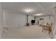 Spacious finished basement with carpet, wood-burning stove, and a comfortable living area at 206 Spring Ln, Chapel Hill, NC 27514