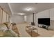 Finished basement featuring carpeted floor, a flatscreen TV, and cozy couches for relaxation at 206 Spring Ln, Chapel Hill, NC 27514