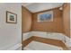 Cozy bathroom featuring neutral tones, a tiled shower-over-tub and a window with natural light at 206 Spring Ln, Chapel Hill, NC 27514