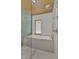 Bathroom features modern shower head and hand held next to large soaking tub at 206 Spring Ln, Chapel Hill, NC 27514