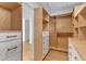 Organized closet with custom wood shelving, white drawers, and hardwood floors for ample storage and style at 206 Spring Ln, Chapel Hill, NC 27514