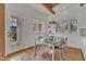Bright dining area features tile floors, a modern table set, and large windows, adjacent to the kitchen at 206 Spring Ln, Chapel Hill, NC 27514