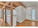 Open entryway with hardwood floors, white walls, and beamed ceilings at 206 Spring Ln, Chapel Hill, NC 27514