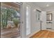 Bright entryway with wood floors, sidelight window, and a view of the porch at 206 Spring Ln, Chapel Hill, NC 27514