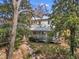 Beautiful home with a well-manicured lawn and mature trees at 206 Spring Ln, Chapel Hill, NC 27514