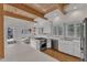 Modern kitchen with stainless steel appliances, white cabinets, and quartz countertops at 206 Spring Ln, Chapel Hill, NC 27514