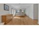 Sun-drenched main bedroom with hardwood floors, a ceiling fan, and a wooden dresser at 206 Spring Ln, Chapel Hill, NC 27514