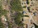 Overhead view of the home highlighting its location within a lush, wooded neighborhood at 208 Hunting Lodge Rd, Clayton, NC 27520