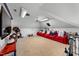 Spacious bonus room with theater seating and large screen TV for entertainment at 208 Hunting Lodge Rd, Clayton, NC 27520