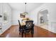 Elegant dining room features hardwood floors, modern chandelier, and stylish furnishings at 208 Hunting Lodge Rd, Clayton, NC 27520