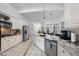 Bright kitchen features stainless appliances, granite counters, and a large center island at 208 Hunting Lodge Rd, Clayton, NC 27520