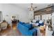Open-concept living room with hardwood floors, comfortable seating, and access to the dining area at 208 Hunting Lodge Rd, Clayton, NC 27520