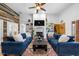 Bright living room featuring a fireplace, built-in shelves, and stylish, comfortable seating at 208 Hunting Lodge Rd, Clayton, NC 27520