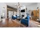 Inviting living room featuring hardwood floors, a fireplace, and comfortable furniture at 208 Hunting Lodge Rd, Clayton, NC 27520