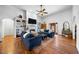 Spacious living room boasts hardwood floors, a fireplace, and plenty of natural light at 208 Hunting Lodge Rd, Clayton, NC 27520