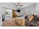 Bright main bedroom featuring a barn door to ensuite bathroom at 208 Hunting Lodge Rd, Clayton, NC 27520