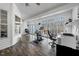Inviting sun room with wood floors, large windows, and lots of natural light at 208 Hunting Lodge Rd, Clayton, NC 27520