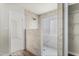 This renovated bathroom features a spacious, tiled walk-in shower with a glass enclosure at 2318 Rogers Rd, Graham, NC 27253