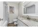 Bathroom features a granite topped vanity and shower/tub combination at 2318 Rogers Rd, Graham, NC 27253