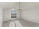 A bright and spacious bedroom offers a large window and modern ceiling fan at 2318 Rogers Rd, Graham, NC 27253