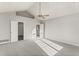 Spacious bedroom with large window, ceiling fan, and ample natural light at 2318 Rogers Rd, Graham, NC 27253