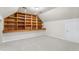 A cozy carpeted bonus room with built-in shelving and recessed lighting creates a comfortable retreat at 2318 Rogers Rd, Graham, NC 27253