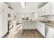 This updated kitchen features stainless appliances, an island, and access to outdoor entertaining areas at 2318 Rogers Rd, Graham, NC 27253