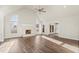 Spacious living room with vaulted ceilings, fireplace, windows and hardwood floors at 2318 Rogers Rd, Graham, NC 27253