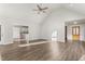 Open living room with vaulted ceilings, hardwood floors, providing a seamless transition to other areas at 2318 Rogers Rd, Graham, NC 27253