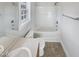 This bathroom is equipped with a shower-tub combo, toilet, sink with vanity, and vinyl flooring at 25 Scotch Bonnet Rdg, Clayton, NC 27520