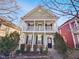 Charming two-story home featuring a quaint front porch and light green siding at 25 Scotch Bonnet Rdg, Clayton, NC 27520