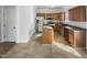 This is a kitchen with tile flooring, wooden cabinets and stainless steel appliances at 25 Scotch Bonnet Rdg, Clayton, NC 27520