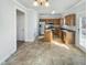 This is a kitchen with tile flooring, wooden cabinets and stainless steel appliances at 25 Scotch Bonnet Rdg, Clayton, NC 27520