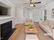Bright living room showcasing a fireplace, neutral tones, and hardwood floors at 25 Scotch Bonnet Rdg, Clayton, NC 27520