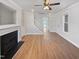 Bright living room showcasing a fireplace, neutral tones, and hardwood floors at 25 Scotch Bonnet Rdg, Clayton, NC 27520